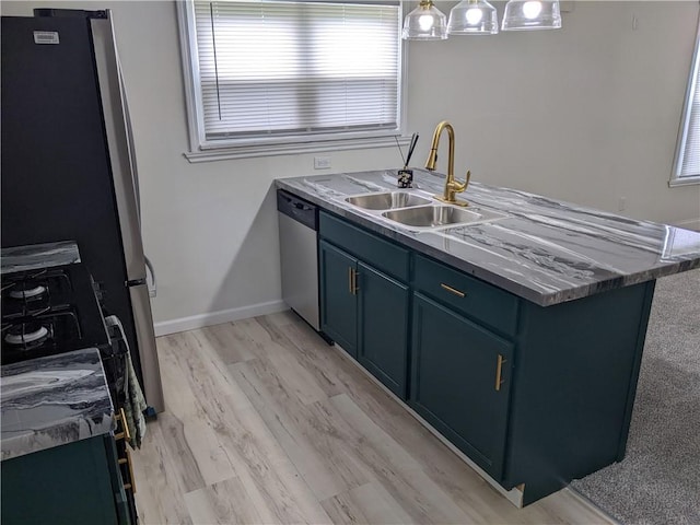 203 W 4th St, Holden, MO 64040 - kitchen with a sink, appliances with stainless steel finishes, blue cabinetry, light wood-style flooring, and baseboards
