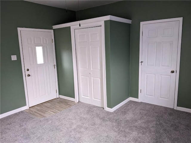 203 W 4th St, Holden, MO 64040 - foyer entrance with carpet and baseboards