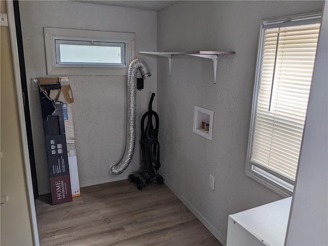 203 W 4th St, Holden, MO 64040 - washroom with washer hookup, wood finished floors, and baseboards