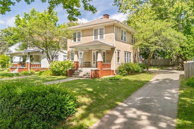2719 Fairleigh Ter, Saint Joseph, MO 64506 - american foursquare style home featuring a porch, a chimney, and stucco siding