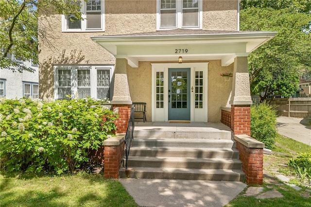 2719 Fairleigh Ter, Saint Joseph, MO 64506 - doorway to property featuring stucco siding and covered porch