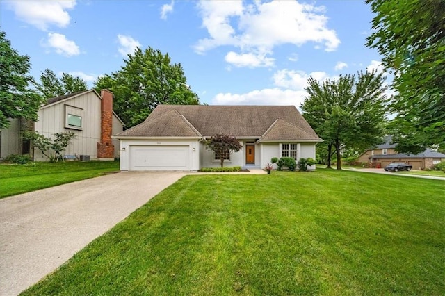9509 W 116th Ter, Overland Park, KS 66210 - view of front facade with an attached garage, driveway, and a front lawn
