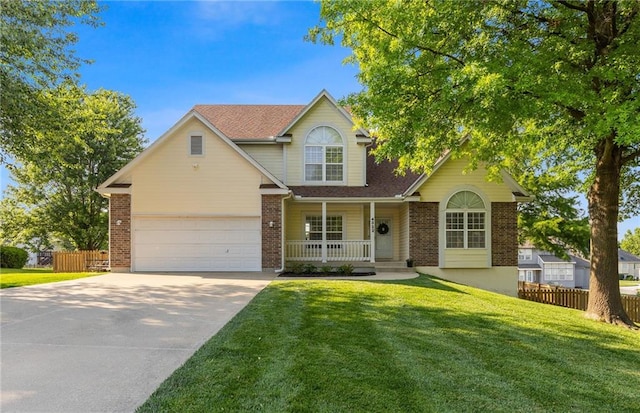 4322 SE Secretariat Ct, Lees Summit, MO 64082 - traditional-style house with covered porch, driveway, an attached garage, brick siding, and a shingled roof