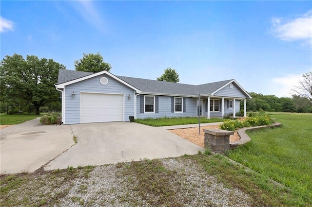25549 Chieftain Rd, Lawrence, KS 66044 - single story home with driveway, an attached garage, and a front lawn