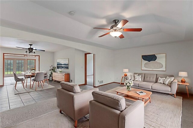 25549 Chieftain Rd, Lawrence, KS 66044 - living area with a ceiling fan, a tray ceiling, and baseboards