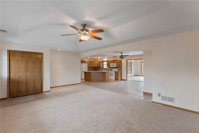 25549 Chieftain Rd, Lawrence, KS 66044 - unfurnished living room with a ceiling fan, baseboards, light carpet, and recessed lighting