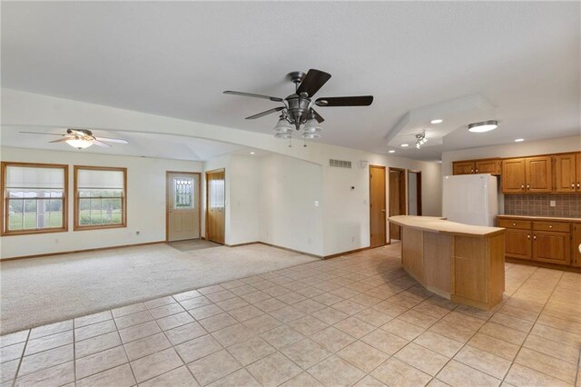 25549 Chieftain Rd, Lawrence, KS 66044 - kitchen featuring freestanding refrigerator, light carpet, a ceiling fan, light tile patterned floors, and recessed lighting