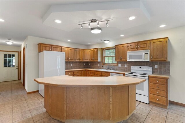 25549 Chieftain Rd, Lawrence, KS 66044 - kitchen featuring white appliances, light countertops, a sink, light tile patterned flooring, and recessed lighting