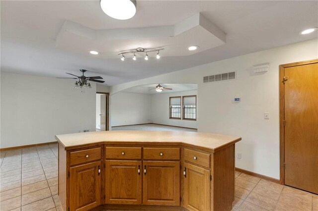 25549 Chieftain Rd, Lawrence, KS 66044 - kitchen featuring a ceiling fan, light tile patterned floors, light countertops, recessed lighting, and baseboards