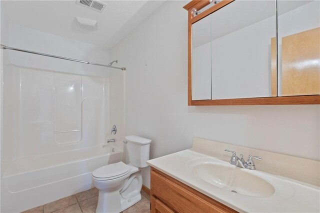 25549 Chieftain Rd, Lawrence, KS 66044 - full bath featuring toilet, vanity, bathtub / shower combination, and tile patterned floors