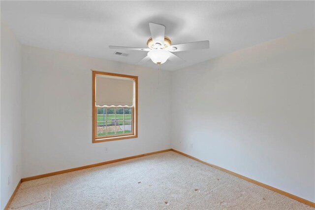 25549 Chieftain Rd, Lawrence, KS 66044 - spare room with carpet, baseboards, and a ceiling fan