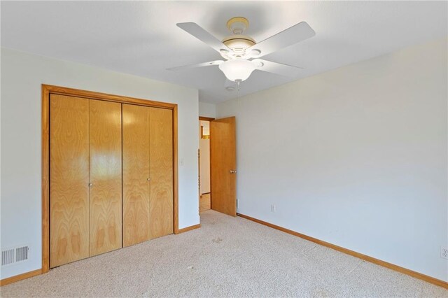 25549 Chieftain Rd, Lawrence, KS 66044 - unfurnished bedroom with carpet flooring, baseboards, a closet, and a ceiling fan