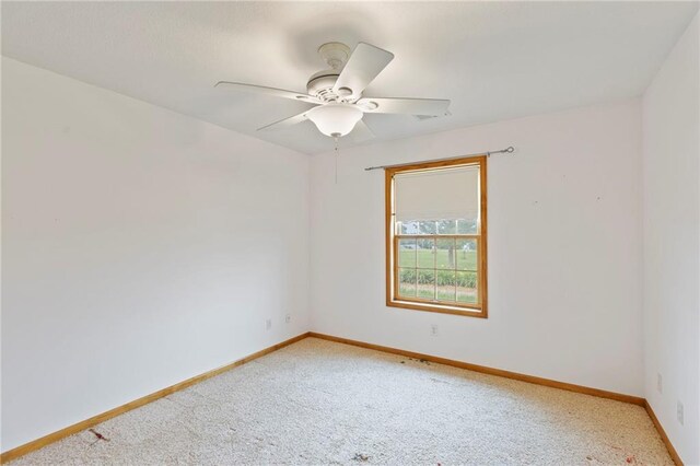 25549 Chieftain Rd, Lawrence, KS 66044 - spare room featuring light carpet, ceiling fan, and baseboards