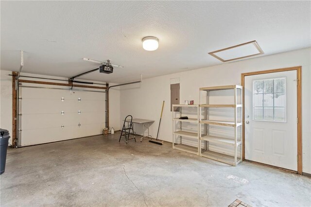 25549 Chieftain Rd, Lawrence, KS 66044 - garage with a garage door opener and electric panel