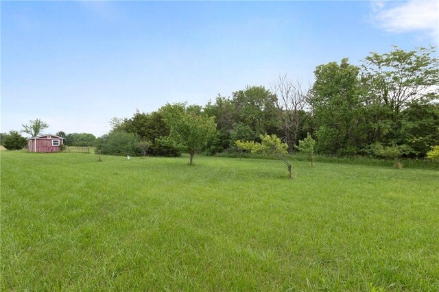 25549 Chieftain Rd, Lawrence, KS 66044 - view of green lawn with an outdoor structure and a view of rural / pastoral area