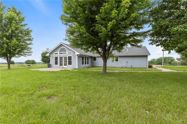 25549 Chieftain Rd, Lawrence, KS 66044 - rear view of property featuring a lawn, french doors, and a patio