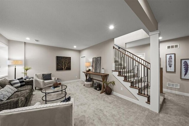 8215 Aurora St, Lenexa, KS 66220 - living area featuring carpet, recessed lighting, stairway, and baseboards