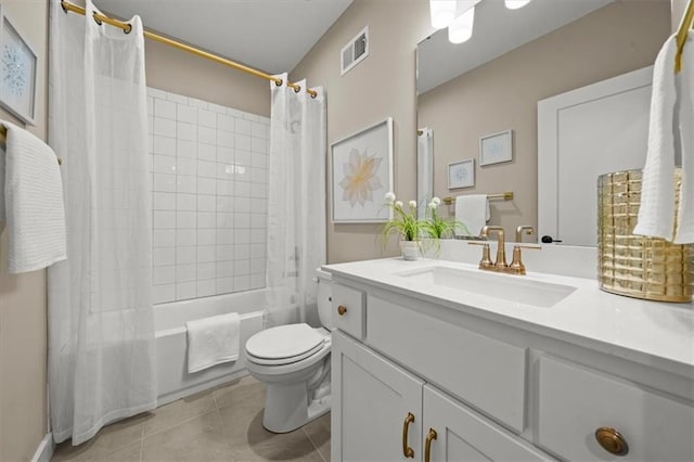 8215 Aurora St, Lenexa, KS 66220 - bathroom featuring vanity, toilet, shower / bath combo with shower curtain, and tile patterned floors