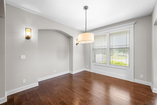 9154 Shady Bend Rd, Lenexa, KS 66227 - spare room with wood finished floors and arched walkways