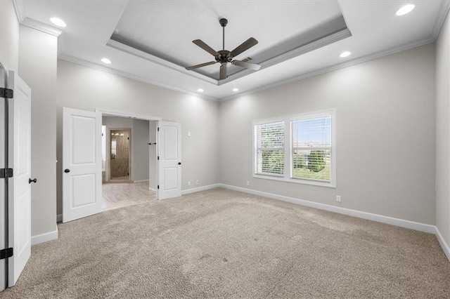 9154 Shady Bend Rd, Lenexa, KS 66227 - unfurnished bedroom with crown molding, a tray ceiling, light carpet, recessed lighting, and ensuite bath