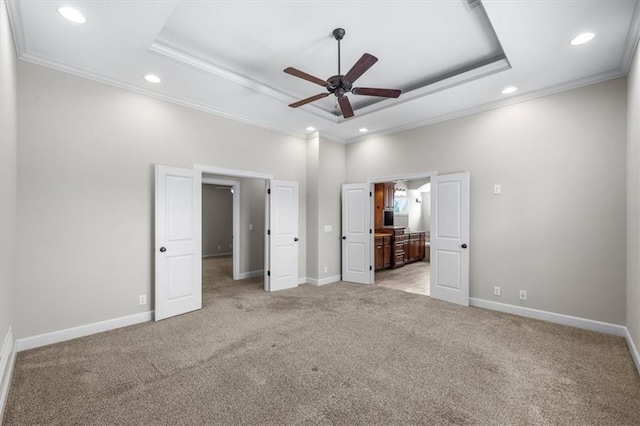 9154 Shady Bend Rd, Lenexa, KS 66227 - unfurnished bedroom featuring a tray ceiling, crown molding, light carpet, recessed lighting, and ensuite bath