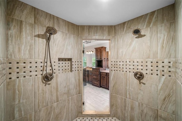 9154 Shady Bend Rd, Lenexa, KS 66227 - bathroom featuring a tile shower and vanity