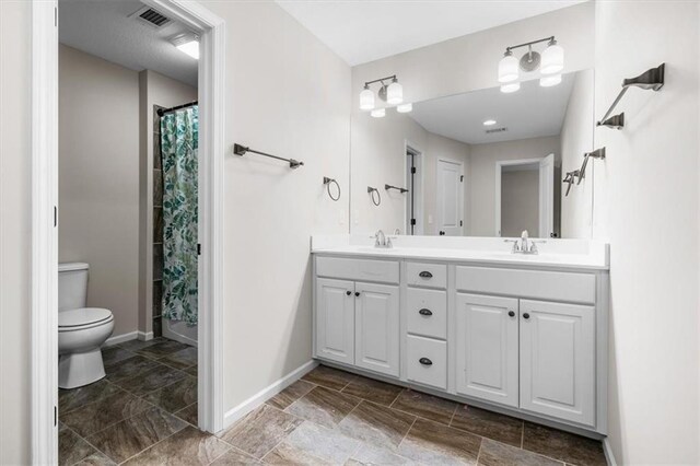 9154 Shady Bend Rd, Lenexa, KS 66227 - full bathroom featuring double vanity, stone tile flooring, and a shower with curtain