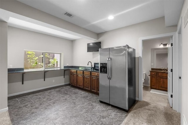 9154 Shady Bend Rd, Lenexa, KS 66227 - kitchen with stainless steel fridge and dark countertops