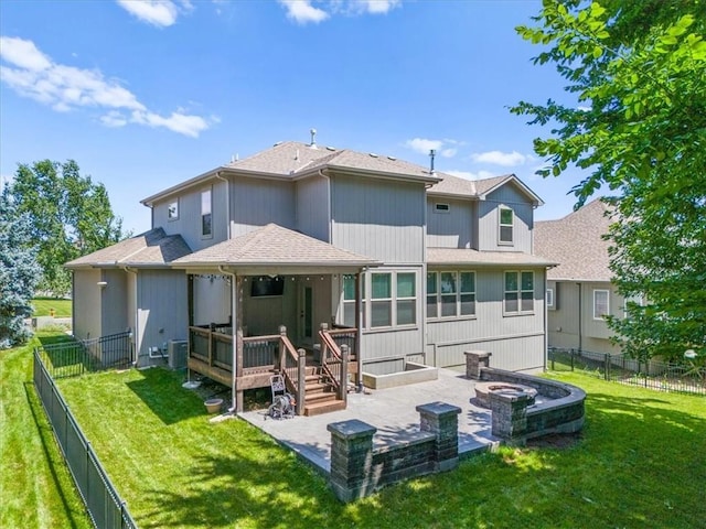 9154 Shady Bend Rd, Lenexa, KS 66227 - back of property featuring a fenced backyard, a patio area, a deck, and a shingled roof