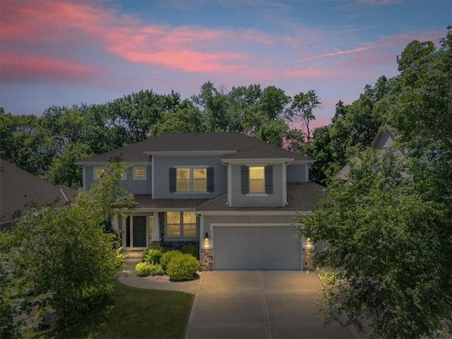 9154 Shady Bend Rd, Lenexa, KS 66227 - view of front of property featuring concrete driveway, an attached garage, and stone siding