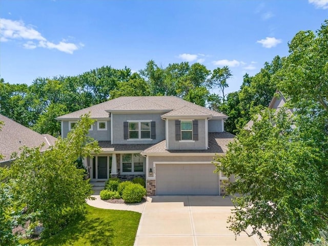 9154 Shady Bend Rd, Lenexa, KS 66227 - view of front of home featuring driveway, stone siding, a garage, stucco siding, and roof with shingles