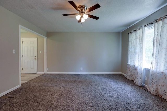 3512 Harvard Ave, Independence, MO 64052 - empty room featuring carpet, a ceiling fan, and a textured ceiling