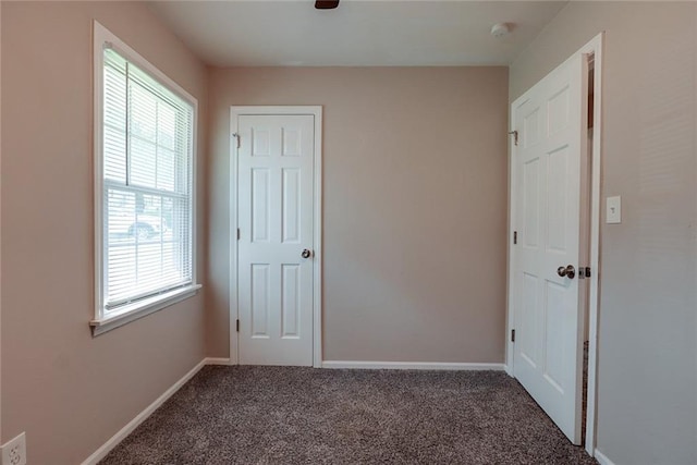 3512 Harvard Ave, Independence, MO 64052 - unfurnished bedroom featuring carpet flooring and baseboards