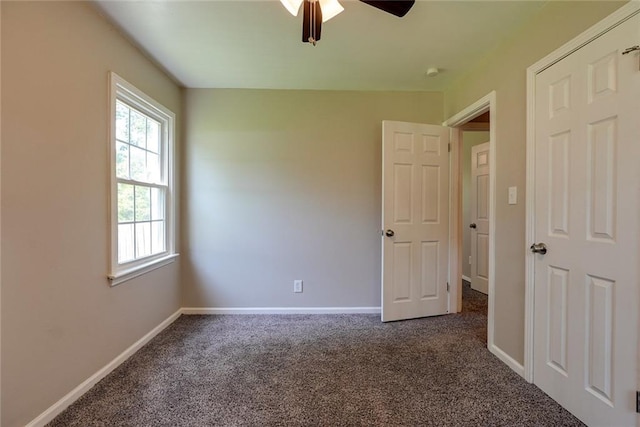 3512 Harvard Ave, Independence, MO 64052 - unfurnished bedroom with carpet floors and a ceiling fan