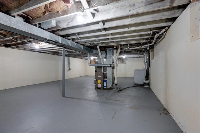 3512 Harvard Ave, Independence, MO 64052 - unfinished basement featuring heating unit
