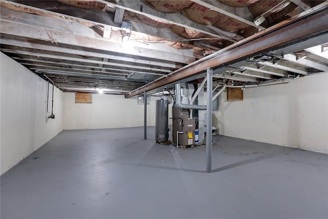 3512 Harvard Ave, Independence, MO 64052 - unfinished below grade area featuring gas water heater and heating unit
