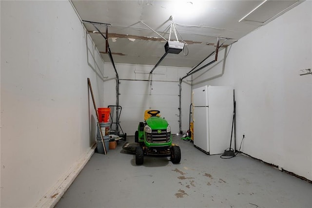 3512 Harvard Ave, Independence, MO 64052 - garage featuring freestanding refrigerator and a garage door opener