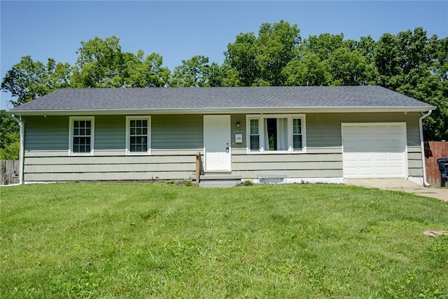 3512 Harvard Ave, Independence, MO 64052 - single story home with a garage, a front yard, concrete driveway, and roof with shingles