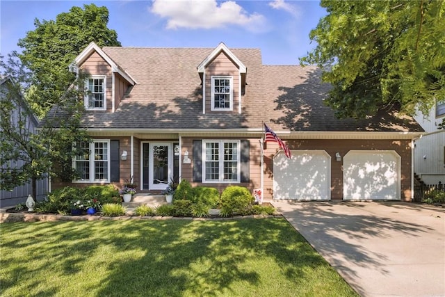 11409 Riley St, Overland Park, KS 66210 - cape cod house featuring concrete driveway, a garage, a front yard, and a shingled roof