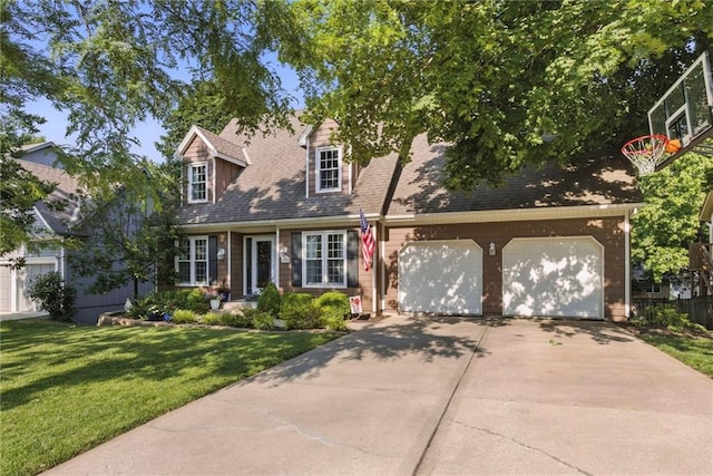11409 Riley St, Overland Park, KS 66210 - cape cod house with concrete driveway, a front yard, and an attached garage