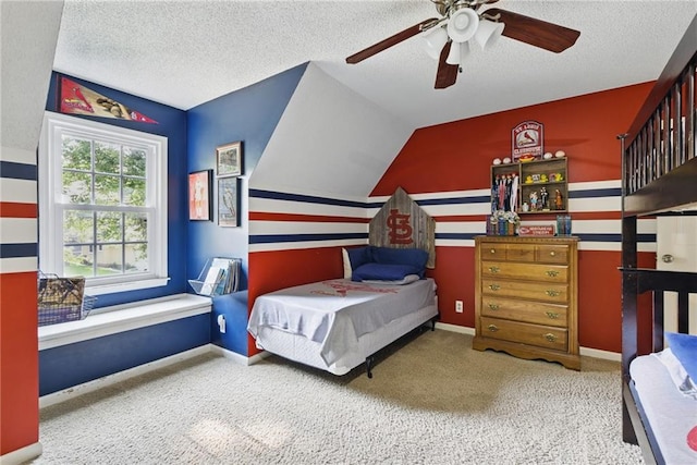 11409 Riley St, Overland Park, KS 66210 - bedroom featuring lofted ceiling, a textured ceiling, carpet, and ceiling fan