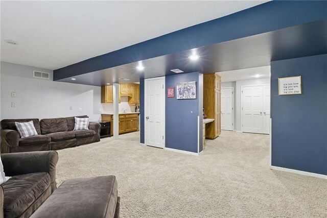 11409 Riley St, Overland Park, KS 66210 - living room featuring light carpet and recessed lighting