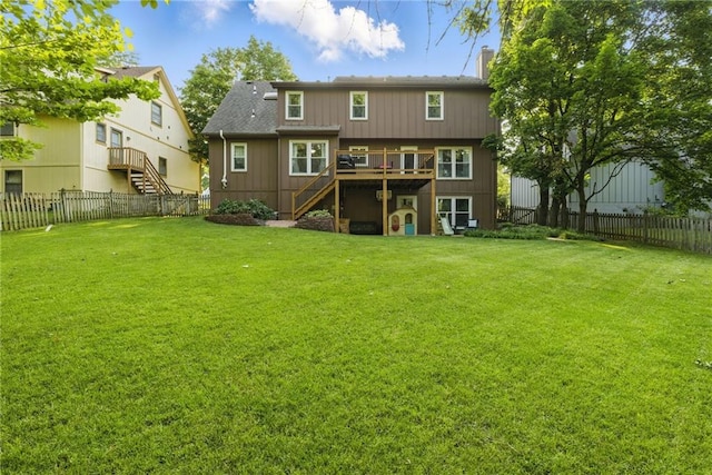 11409 Riley St, Overland Park, KS 66210 - back of property with stairs, a wooden deck, and a fenced backyard