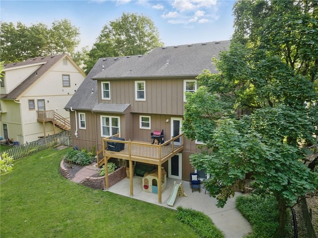 11409 Riley St, Overland Park, KS 66210 - rear view of property with a patio, a shingled roof, and a wooden deck