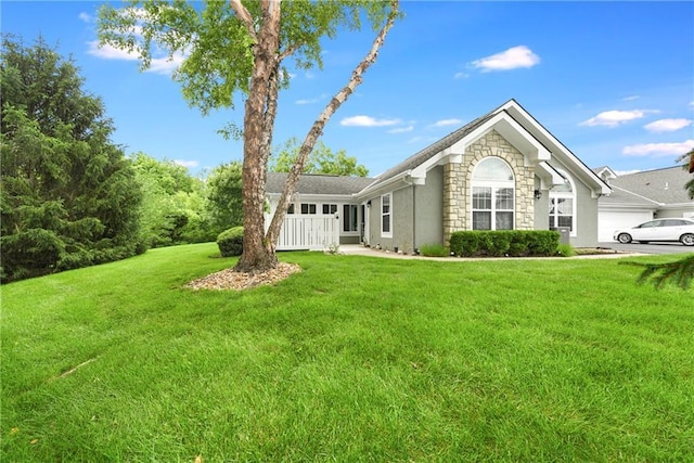 7226 Meadow View St, Shawnee, KS 66227 - view of front of property with stone siding, stucco siding, and a front lawn