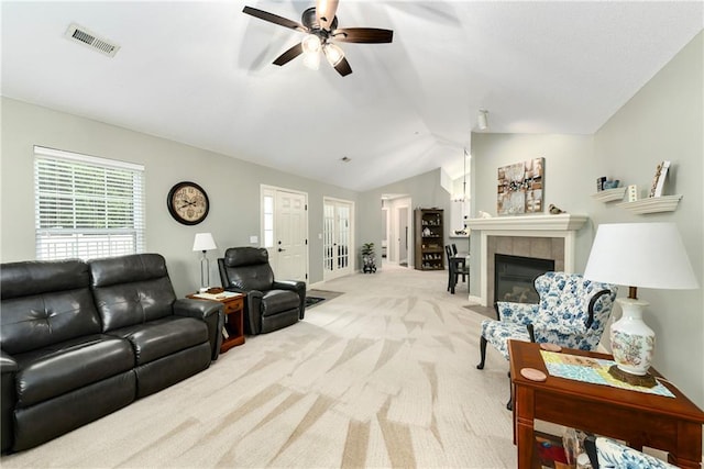 7226 Meadow View St, Shawnee, KS 66227 - living room with ceiling fan, carpet, plenty of natural light, vaulted ceiling, and a tiled fireplace