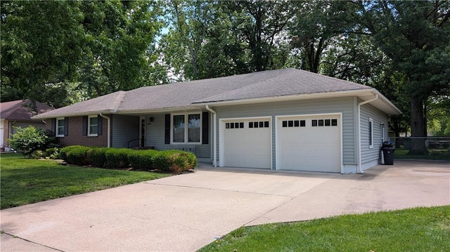 2006 Colonial Dr, Pittsburg, KS 66762 - ranch-style house with an attached garage and concrete driveway