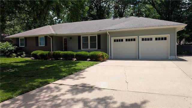 2006 Colonial Dr, Pittsburg, KS 66762 - ranch-style home with a garage, a front lawn, and concrete driveway