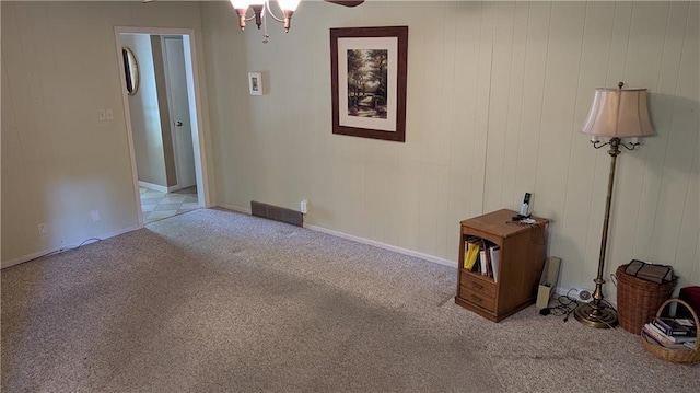 2006 Colonial Dr, Pittsburg, KS 66762 - unfurnished living room featuring carpet and ceiling fan