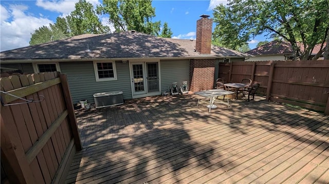 2006 Colonial Dr, Pittsburg, KS 66762 - wooden terrace featuring outdoor dining area, a fenced backyard, and central air condition unit